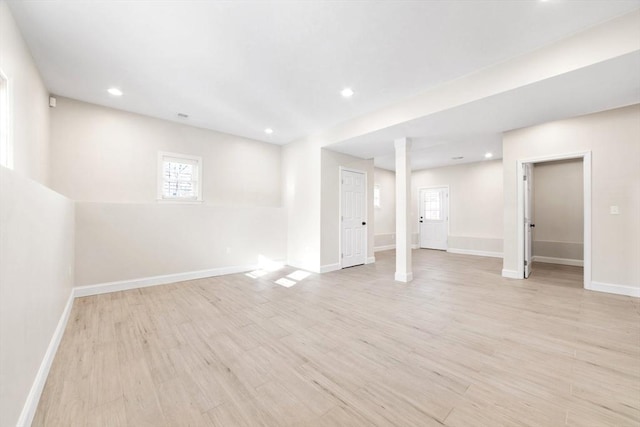 basement with light wood-style floors, baseboards, and recessed lighting