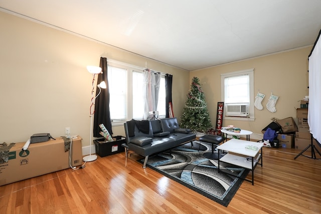 living room featuring cooling unit and light wood-type flooring