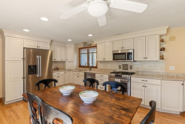 dining area featuring recessed lighting, ceiling fan, and light wood-style flooring