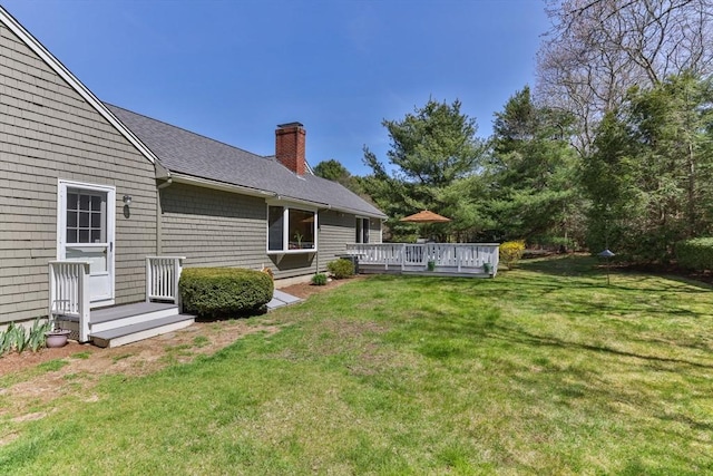 view of yard with a wooden deck