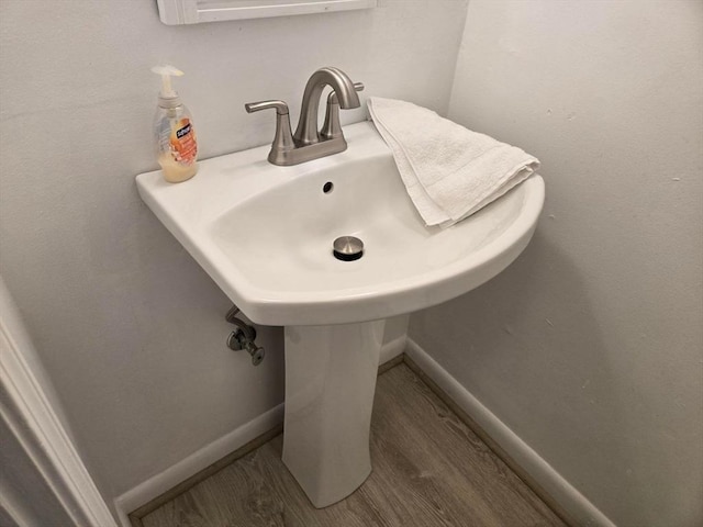 bathroom with hardwood / wood-style flooring