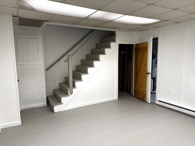 basement featuring a paneled ceiling