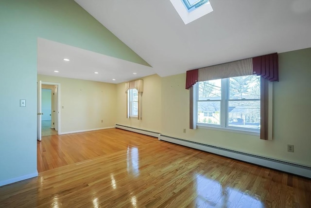 unfurnished room with a baseboard heating unit, lofted ceiling with skylight, recessed lighting, and light wood finished floors