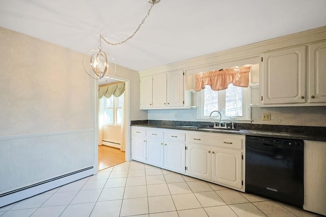 kitchen with dishwasher, dark countertops, baseboard heating, and a sink