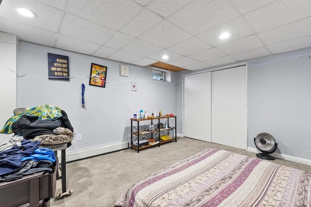 bedroom featuring recessed lighting, a baseboard heating unit, baseboards, and carpet