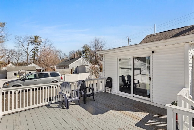 wooden deck featuring fence