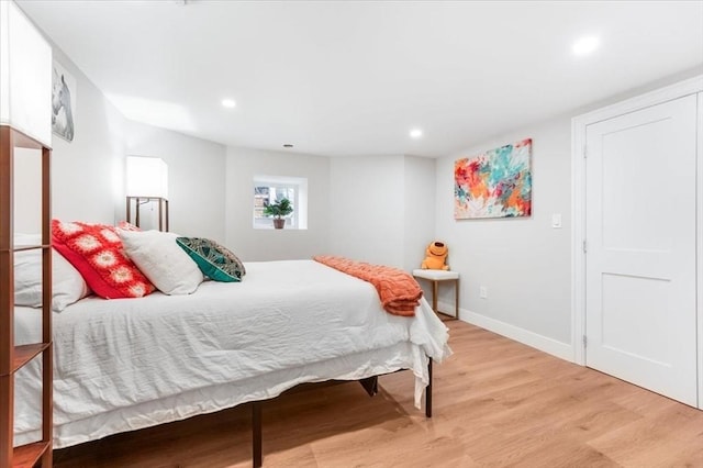 bedroom with light wood-type flooring