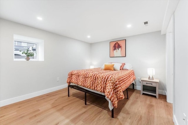 bedroom with light hardwood / wood-style floors