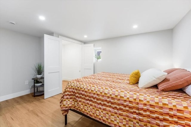 bedroom with light hardwood / wood-style flooring