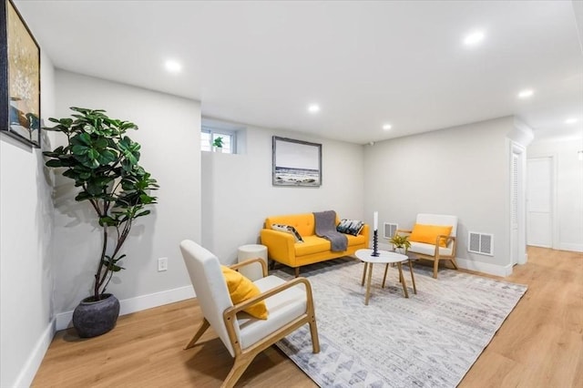 living room with light hardwood / wood-style floors