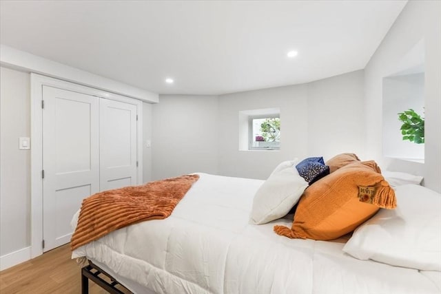 bedroom with a closet and light wood-type flooring