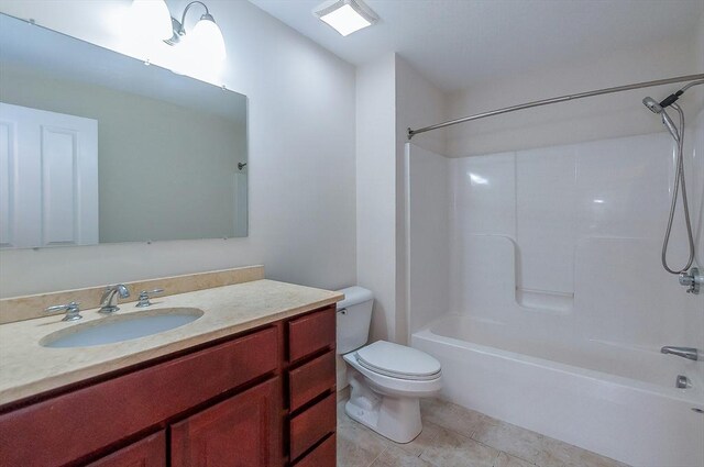 bathroom with  shower combination, tile patterned flooring, vanity, and toilet