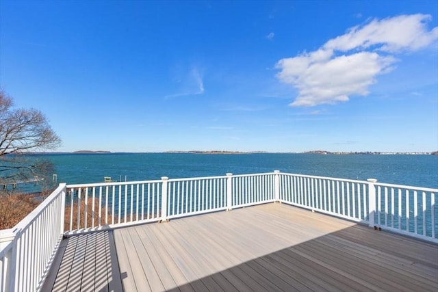 view of dock featuring a deck with water view