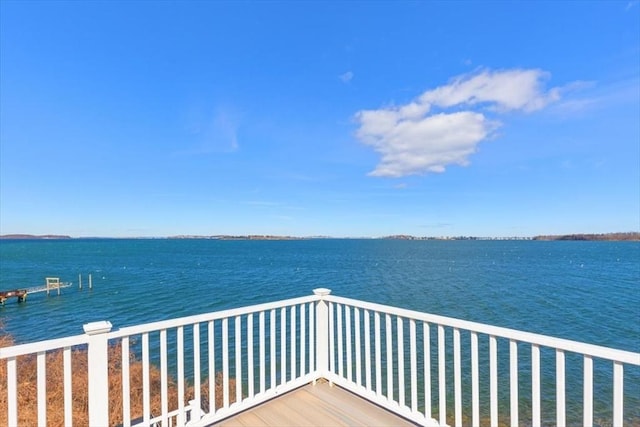 wooden deck with a water view