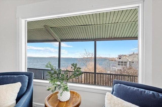 sitting room featuring a water view