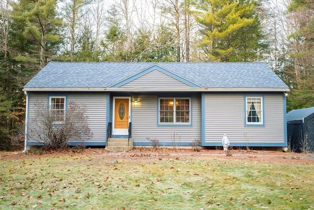 single story home featuring a front yard