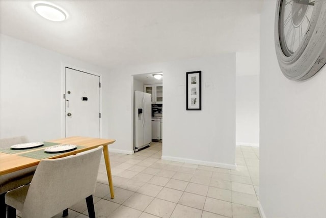 215 Winter St Unit 5R, Weymouth, MA 02188 - dining room with light tile patterned floors and baseboards