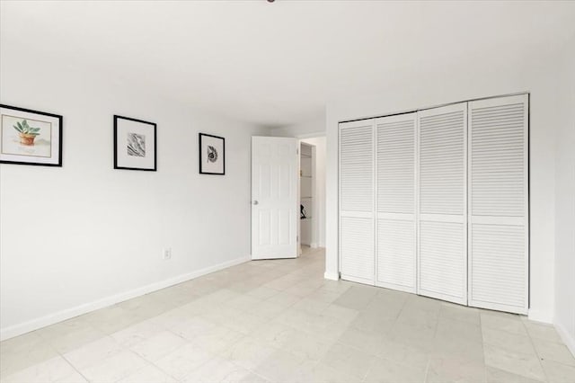 215 Winter St Unit 5R, Weymouth, MA 02188 - unfurnished bedroom featuring baseboards and a closet