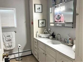 bathroom with vanity, tile patterned floors, and a baseboard radiator