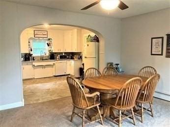 dining space with ceiling fan