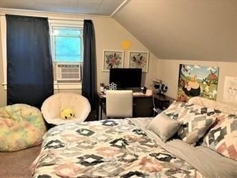 bedroom featuring cooling unit, carpet, and lofted ceiling