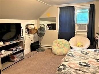 bedroom featuring carpet, vaulted ceiling, a baseboard radiator, and cooling unit