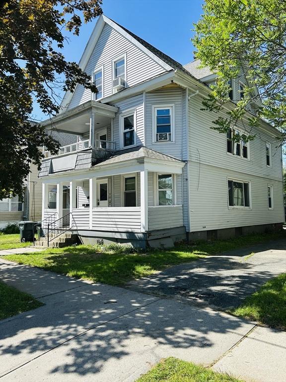 31 Denton Cir, Springfield, MA 01104 - view of front of house with a balcony, a porch, and driveway