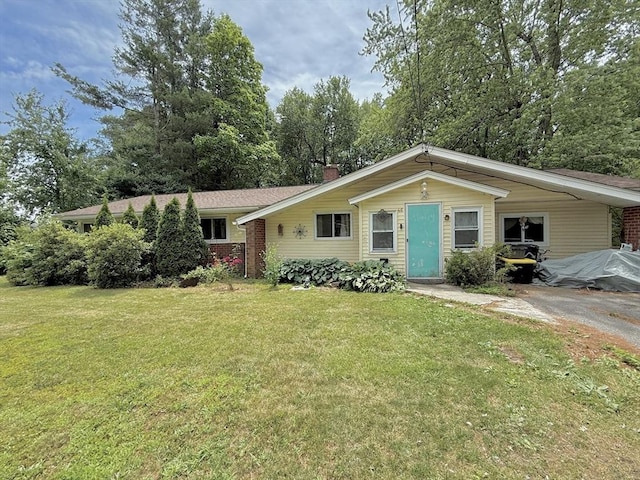 46 Barry Rd, Worcester, MA 01609 - view of front of home featuring a front yard, brick siding, and a chimney