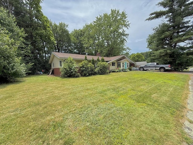 46 Barry Rd, Worcester, MA 01609 - view of front facade featuring a front lawn and a chimney