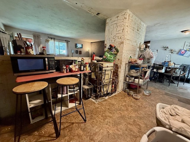 46 Barry Rd, Worcester, MA 01609 - bar area featuring stainless steel microwave and a textured ceiling