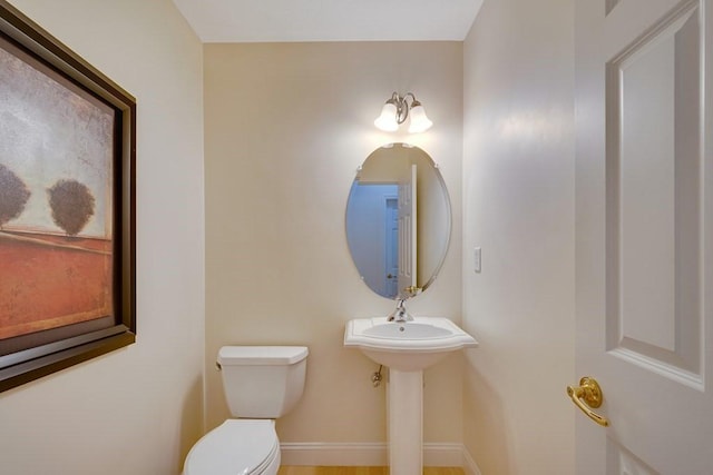 bathroom featuring toilet