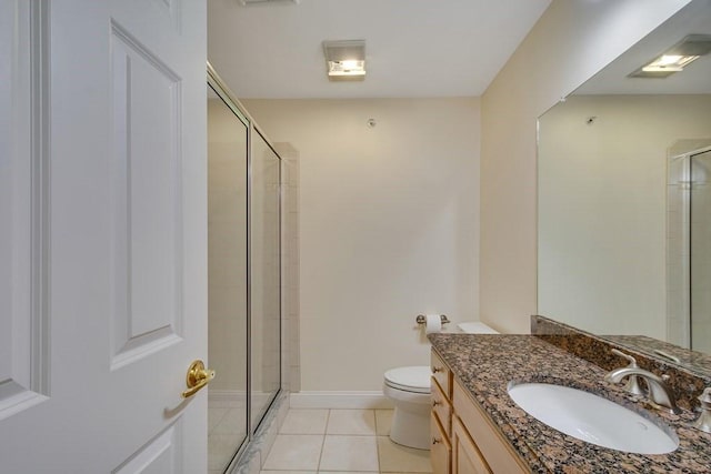 bathroom with vanity, tile patterned floors, and a shower with shower door