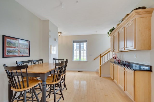 dining area with light hardwood / wood-style flooring