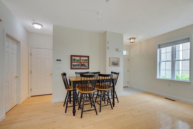 dining area with light wood-type flooring