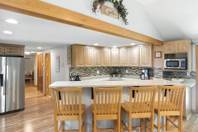 6 Hillcrest Dr, Hopkinton, MA 01748 - kitchen featuring stainless steel appliances, decorative backsplash, light wood-type flooring, a peninsula, and recessed lighting