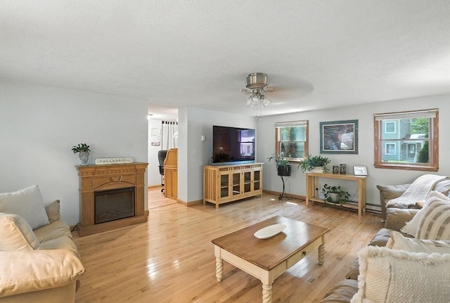 6 Hillcrest Dr, Hopkinton, MA 01748 - living area featuring light wood-style floors, a ceiling fan, and a fireplace