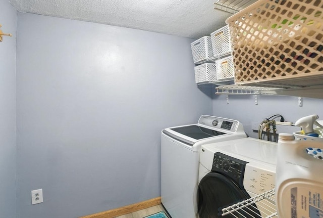 6 Hillcrest Dr, Hopkinton, MA 01748 - laundry area with washing machine and clothes dryer, a textured ceiling, and water heater
