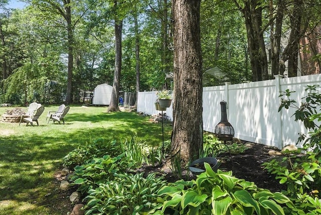 6 Hillcrest Dr, Hopkinton, MA 01748 - fenced backyard featuring a storage shed and a fire pit