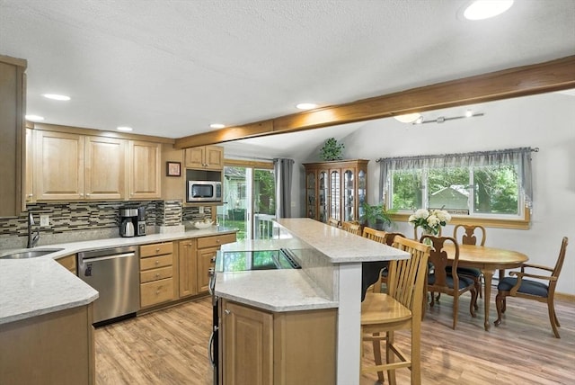 6 Hillcrest Dr, Hopkinton, MA 01748 - kitchen featuring appliances with stainless steel finishes, a breakfast bar, a kitchen island, light wood finished floors, and recessed lighting