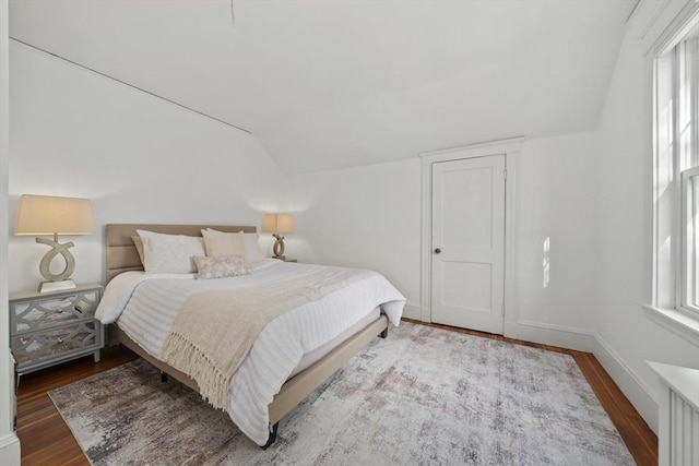 40 S Crescent Circuit, Boston, MA 02135 - bedroom with lofted ceiling, wood finished floors, multiple windows, and baseboards
