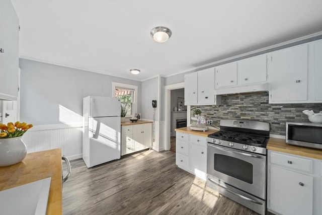 40 S Crescent Circuit, Boston, MA 02135 - kitchen featuring butcher block countertops, appliances with stainless steel finishes, dark wood-style flooring, tasteful backsplash, and a wainscoted wall