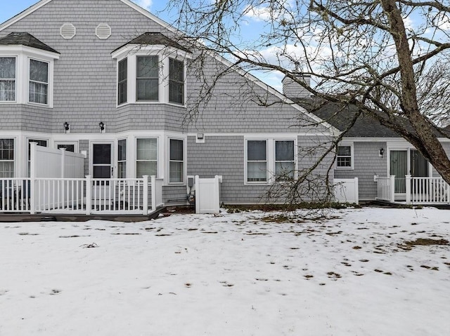 view of snow covered house