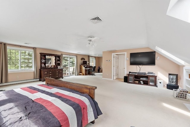 carpeted bedroom featuring a baseboard heating unit