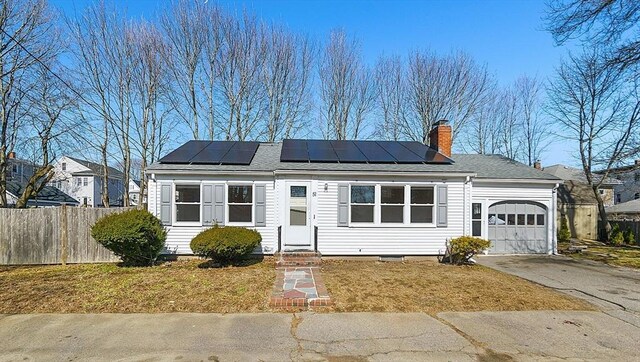 ranch-style home featuring driveway, a garage, fence, and entry steps