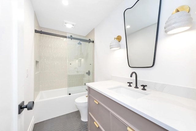 full bath featuring toilet, tile patterned floors, enclosed tub / shower combo, and vanity