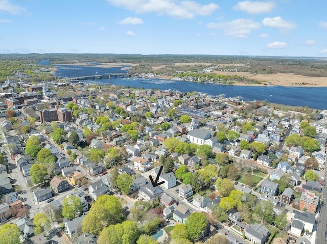 birds eye view of property with a water view and a residential view
