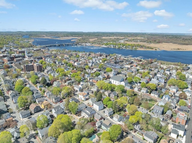 drone / aerial view featuring a water view and a residential view