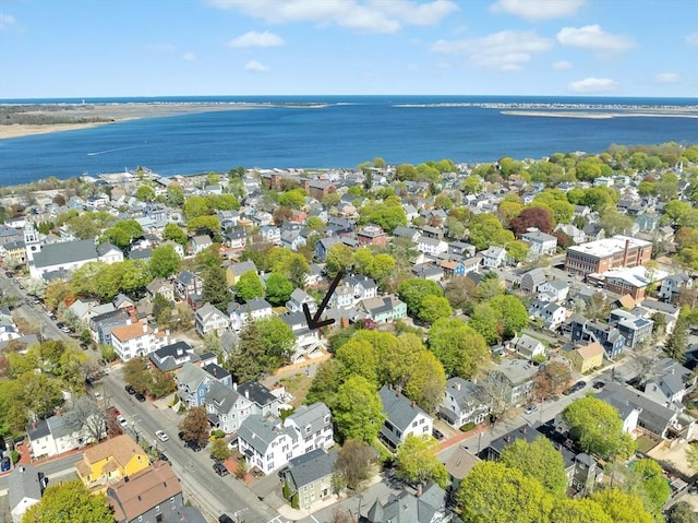 bird's eye view featuring a water view and a residential view