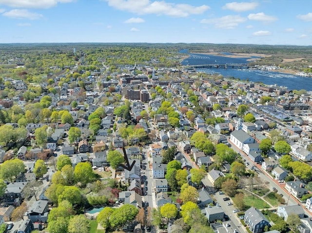 drone / aerial view featuring a water view and a residential view