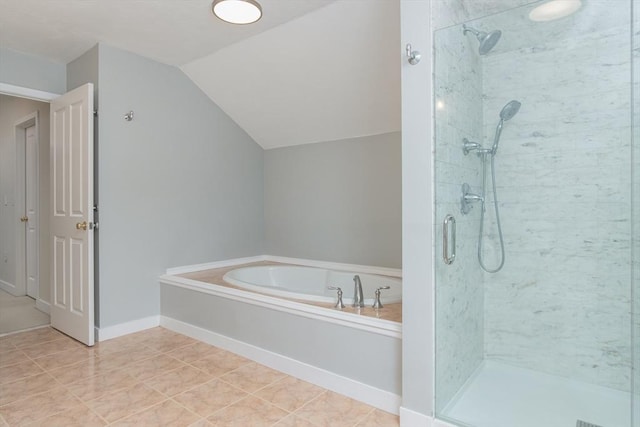 full bathroom with a garden tub, baseboards, a stall shower, and lofted ceiling